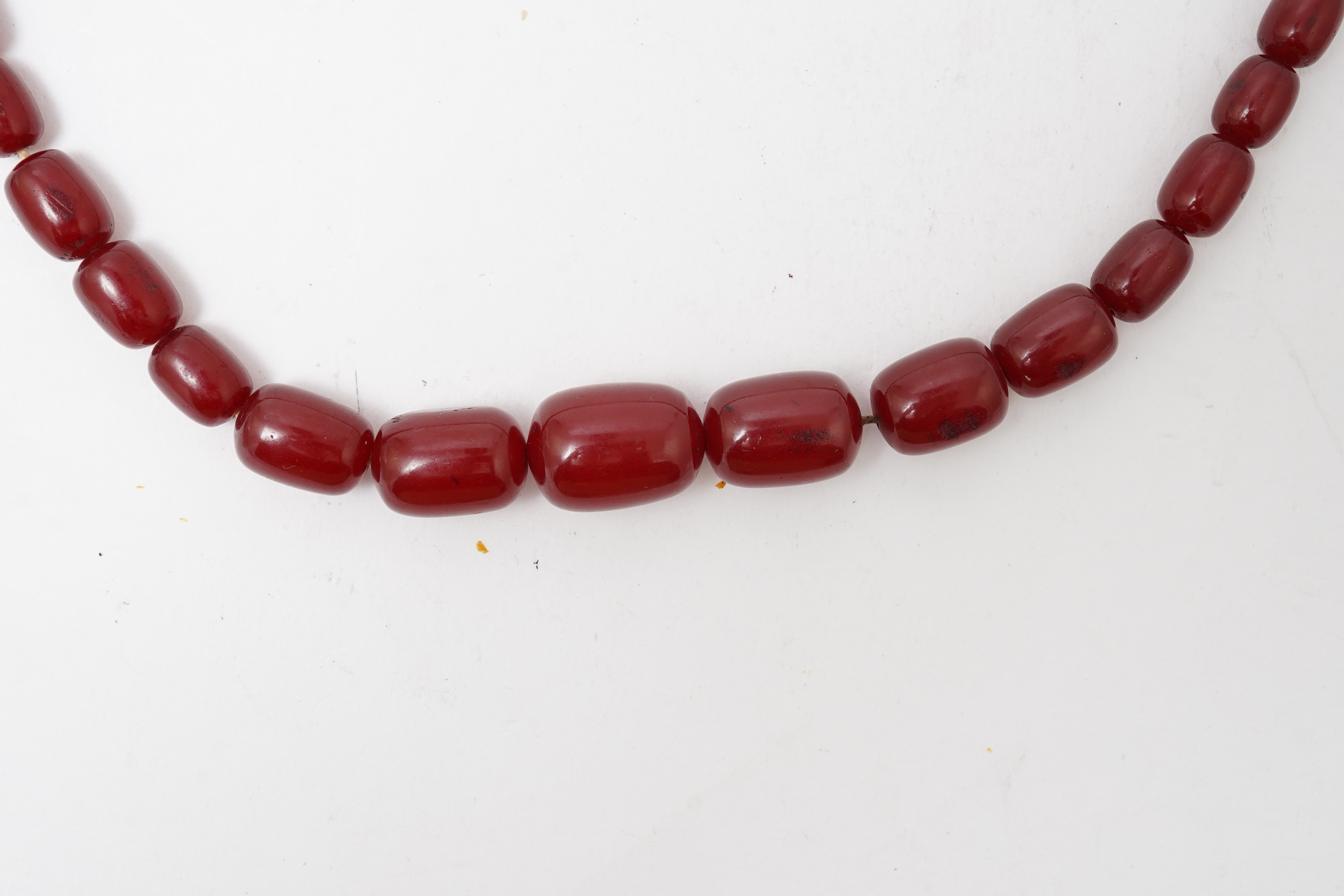 A cherry-coloured bakelite 'amber' necklace
